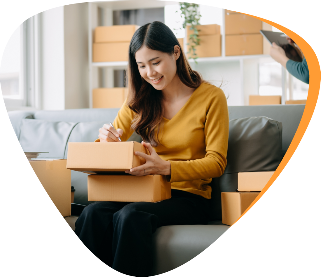 woman writing on parcels