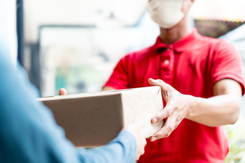 Asian,Postman,,Deliveryman,Wearing,Mask,Carry,Small,Box,Deliver,To