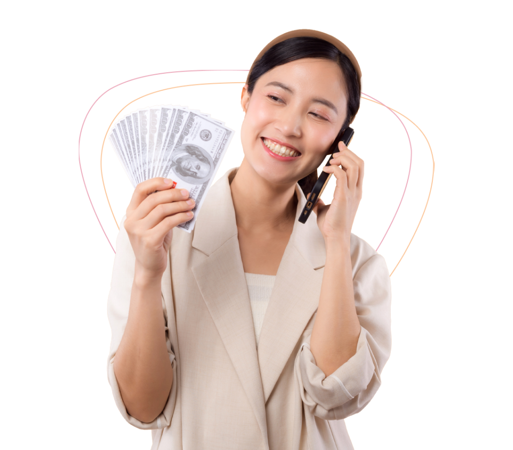 woman holding dollars while on the phone